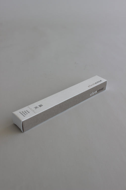 White rectangular object with text on a gray background